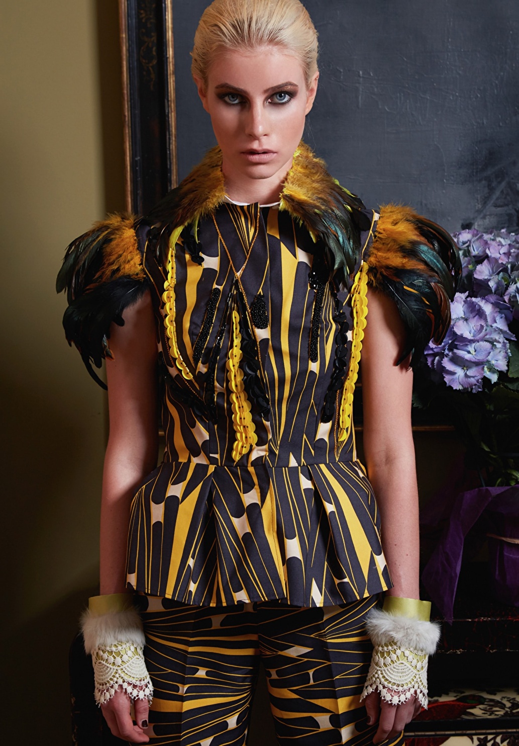 Blonde model with static position wearing a very fashionable outfit.